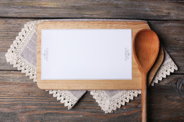 Cutting board with menu sheet of paper