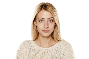 portrait of serious young blonde without make up