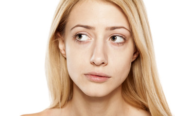 Naklejka premium portrait of concerned young blonde without make up