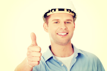 Portrait of a builder in a white helmet