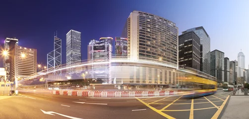 Fotobehang Panorama of a busy road in Hong Kong from day to night © ymgerman