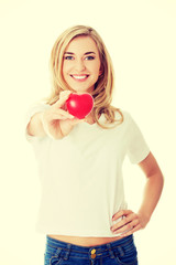 Smiling woman with red heart