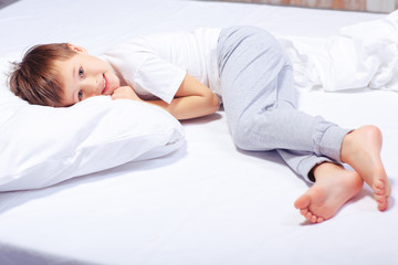 Portrait of a boy in bed with pajama