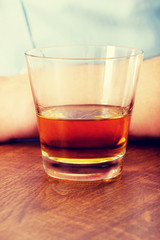 Yound man in depression, drinking alcohol