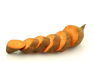 a cut sweet potato on a white background