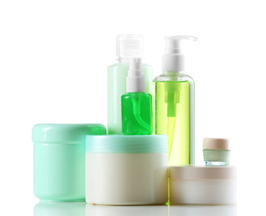 Cosmetic bottles on white background
