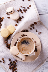 Gentle colorful macaroons and  coffee in mug