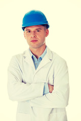Man in a lab coat and helmet