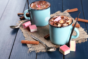 Mugs of hot coffee with marshmallow