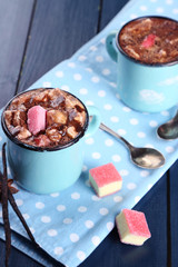 Mugs of hot coffee with marshmallow