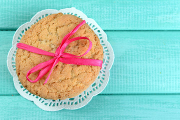 Tasty cookies on color wooden background