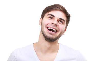 Obraz premium Portrait of smiling young man isolated on white