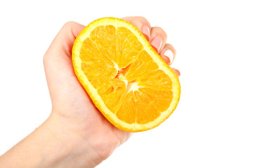 Female hand squeezing orange isolated on white