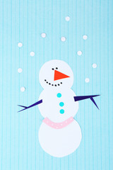Handmade snowman on bright background