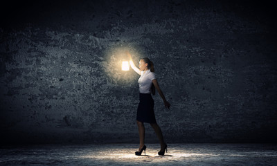 Fototapeta premium Businesswoman with lantern