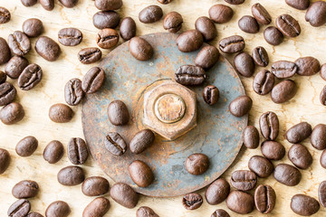 Coffee bean and nuts on grunge wooden background