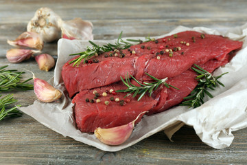 Raw beef steak with rosemary and garlic