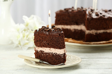 Fototapeta na wymiar Delicious chocolate cake on table on light background