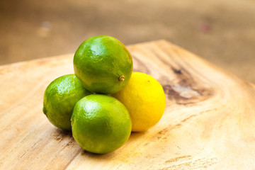 Fresh limes on wooden table
