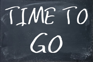 time to go text write on blackboard