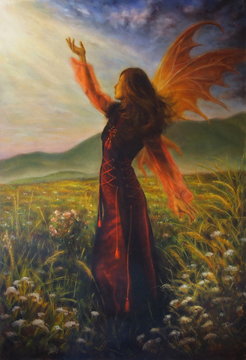 airy woman in a historic dress standing in rays of sunlight amid