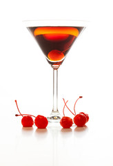 Manhattan cocktail garnished with a cherry