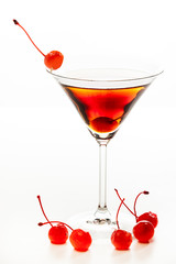 Manhattan cocktail garnished with a cherry
