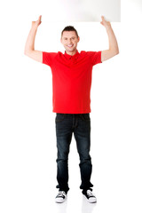 Happy man showing and displaying placard