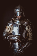 Male in ancient armor. Isolated on black