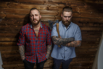 Two huge brutal males with tattooes and beards