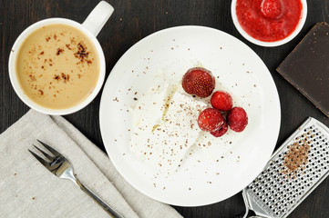 Cottage cheese with fresh berries and coffee with milk for break
