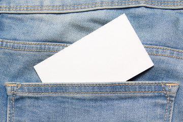 visiting card in back pocket of blue jeans