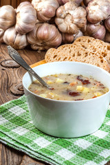 Sour soup with bread.