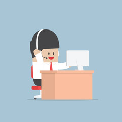 Obraz premium Businessman work as a call center with headphone and computer