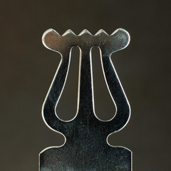 closeup of ornament on old metal music stand