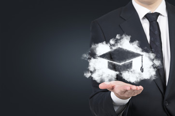 businessman holding bachelor hat