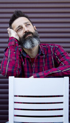 hipster sitting gesticulating