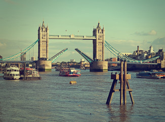 London UK, River Thames. Raised to allow tourist boat. Retro fil