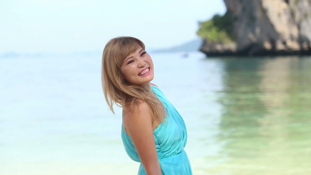 beautiful blonde asian girl in blowing transparent blue dress sm