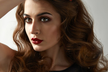 Naklejka premium Beautiful sexy woman color makeup red lips blue eyes cosmetics
