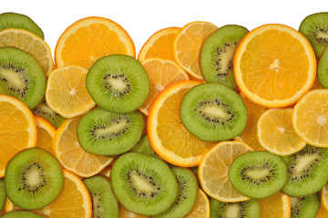 Heap of orange, lemon and kiwi slices on a white