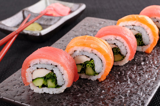 Salmon & tuna sushi roll with chopsticks