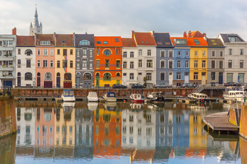 River Leie, colored houses and Belfry tower in Ghent, Belgium