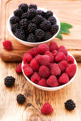 Summer berries in bowls, top view