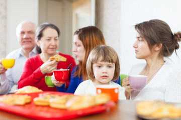  family having breakfast at home together