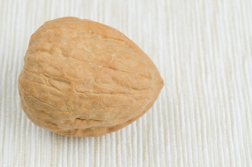 walnut on table cloth, close up