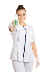 Female doctor holding up oxygen mask