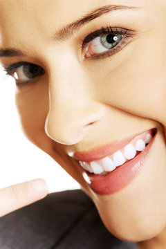 Woman showing her perfect white teeth