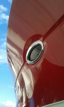 red Motor Boat Hull of super yacht and porthole	