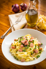 Fettuccine with ham and peas, Italian cuisine